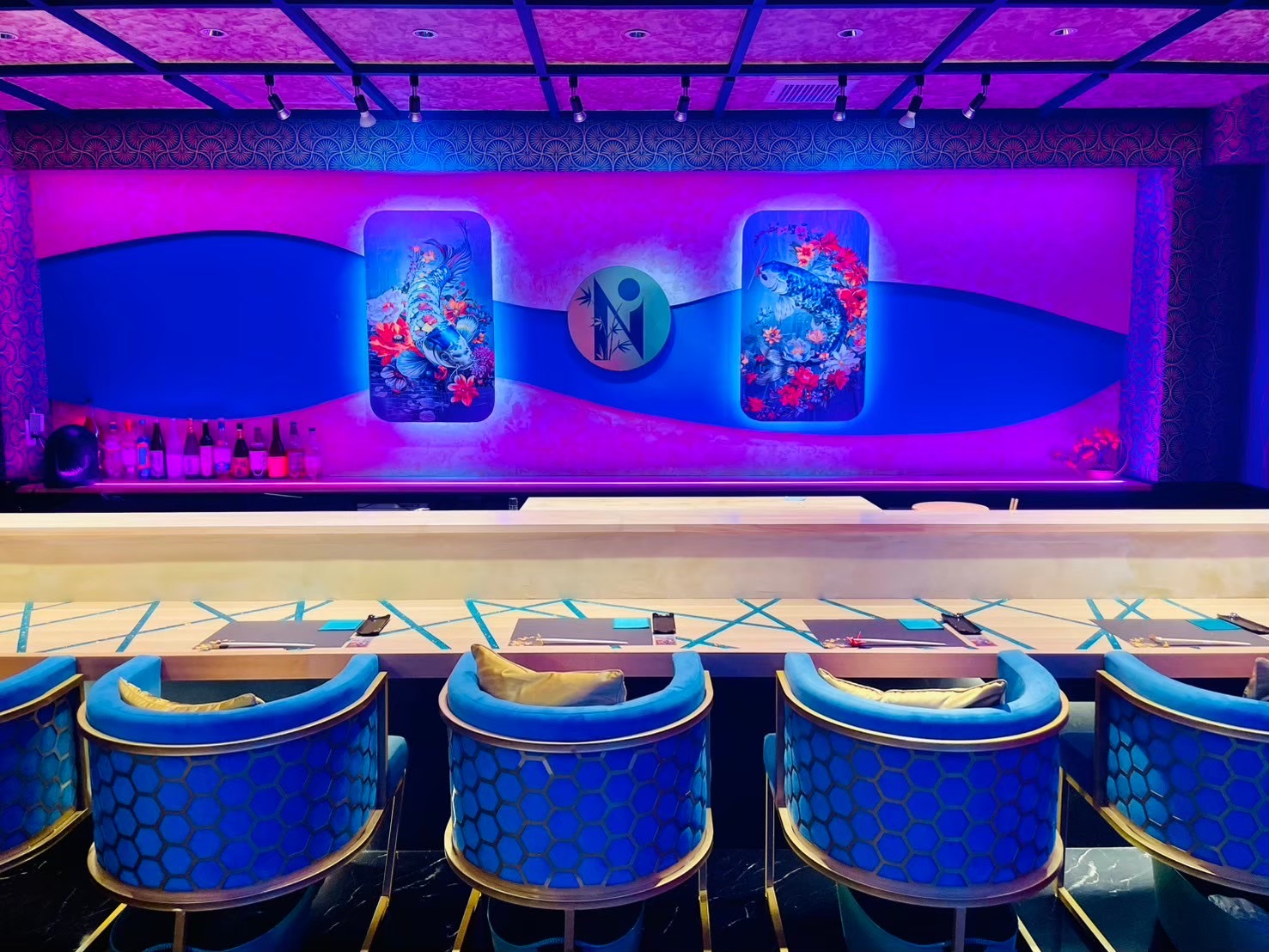 SHIN NIPPON's eight-seat counter surrounded by neon light and art