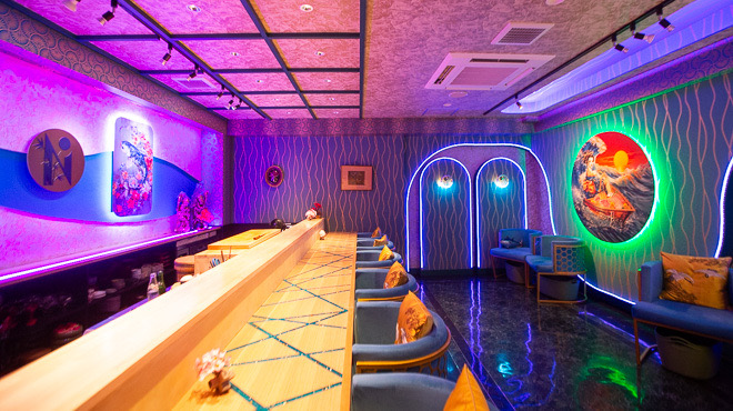 The counter and illuminated art inside SHIN NIPPON